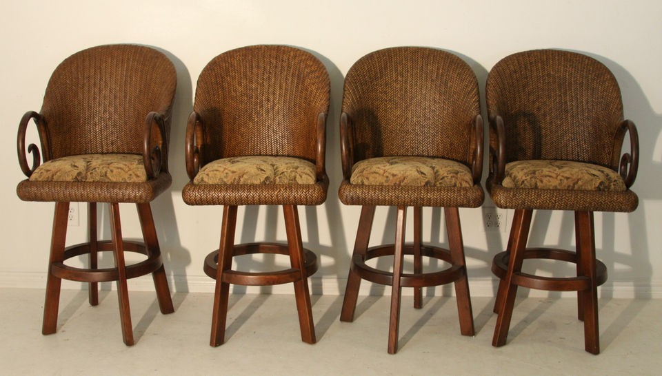 Four Rattan Bar Stools Accented with Scrolled Arms and Upholstered 