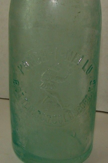 1930s Punch I Nello Jester Goldsboro Embossed Str Side Soda Bottle